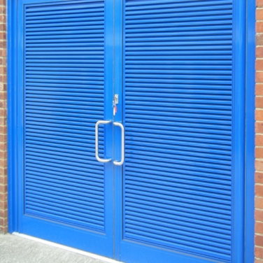 AVS34 Aluminium Glazed-In Louvres inserted into Commercial Doors